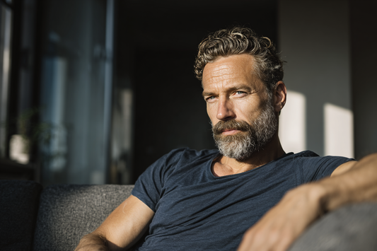 A confident mature man in a calm lifestyle setting representing early male wellness awareness, daily balance, and long-term prostate care