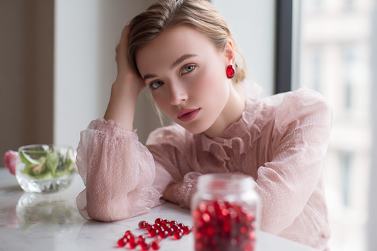 A modern woman in a fresh elegant lifestyle setting representing cranberry-inspired feminine wellness and routine daily care