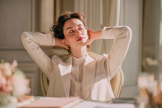 A modern working woman balancing schedule pressure with calm self-care habits in an elegant real-life setting