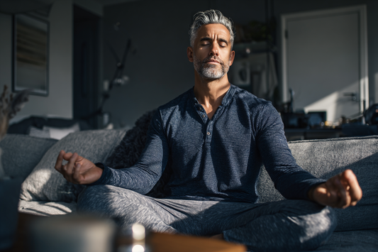 A modern man calmly following a steady morning wellness routine at home, representing consistency, discipline, and sustainable men’s health habits
