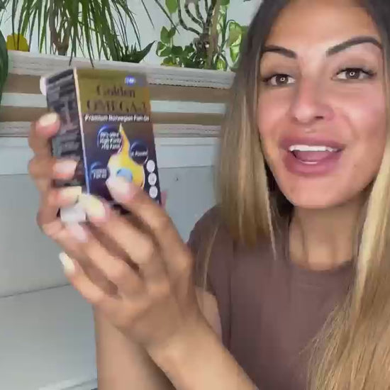 Customer review video thumbnail of a woman presenting BioHarmony Golden Omega-3 fish oil box with indoor plants in the background (影片 / video)